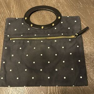 Kate Spade New York small clothe clutch zip closure on front, pre owned